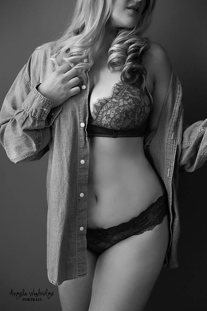 boudoir pic, woman in state of undress, taking off husband's shirt, sexy photo