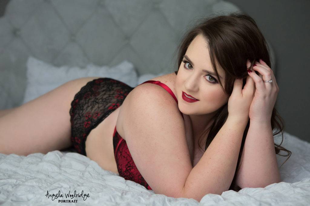 pretty woman lying on bed, boudoir photo