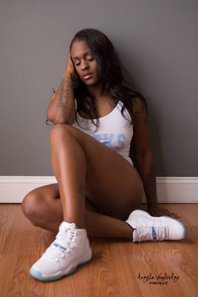 beautiful black woman sitting on floor