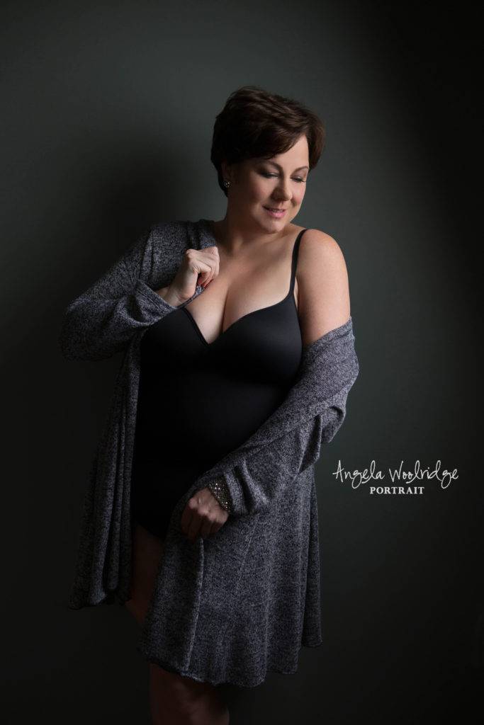 Sexy curvy lady in a sweater, boudoir photo